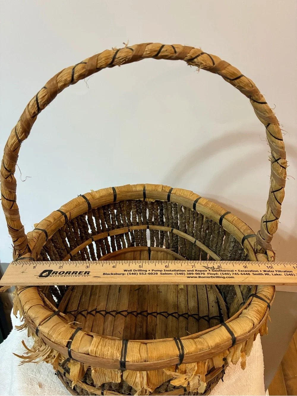 Handcrafted rustic corn husk and twig folk art basket